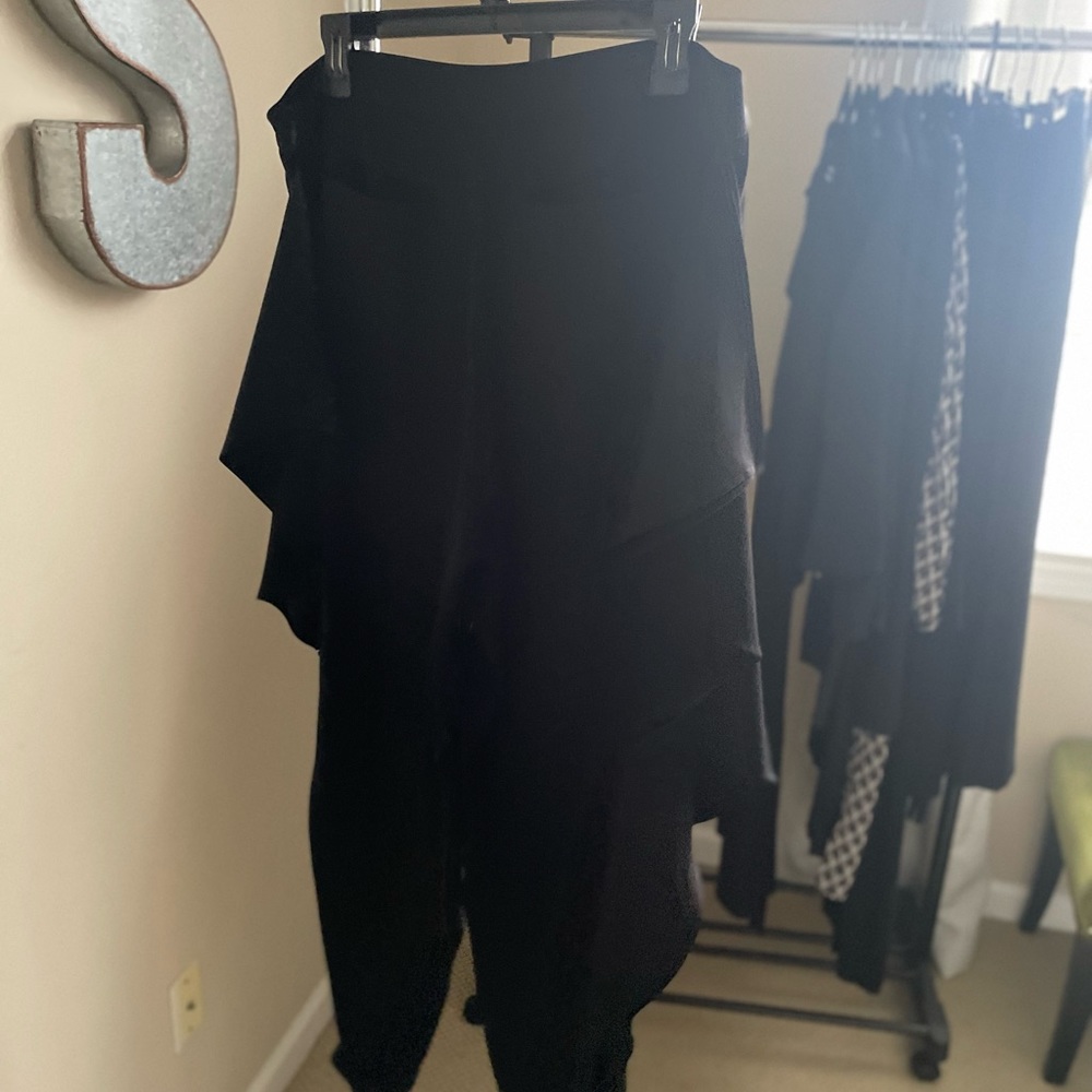 Cool pants with “wings” and zipped ankles. Unique look!